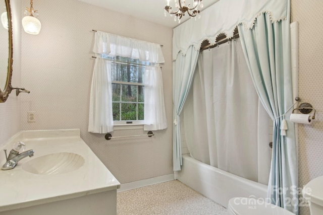 full bathroom with vanity, shower / tub combo, an inviting chandelier, and toilet