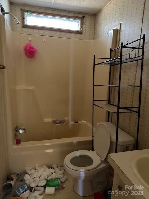 full bathroom featuring vanity, tile patterned flooring, tub / shower combination, and toilet