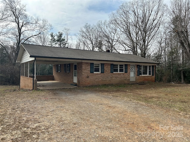 single story home with a carport