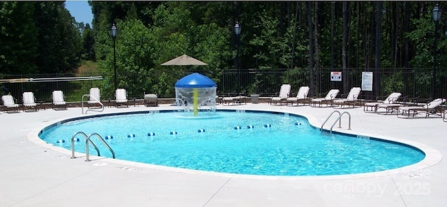 view of swimming pool featuring a patio area and pool water feature