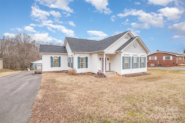 ranch-style home with a front lawn