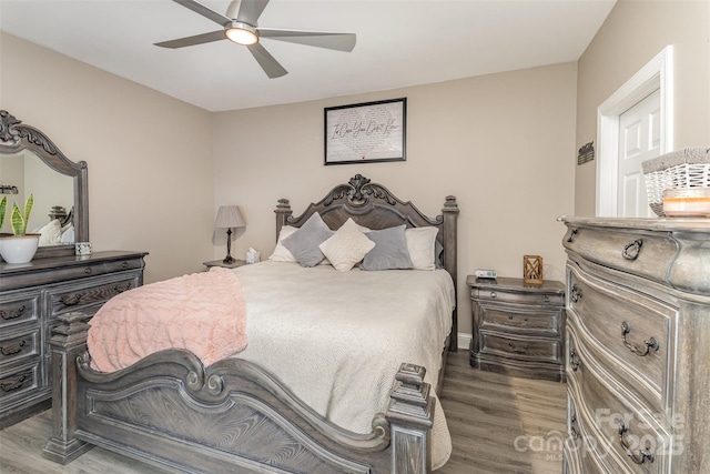 bedroom featuring dark hardwood / wood-style floors and ceiling fan