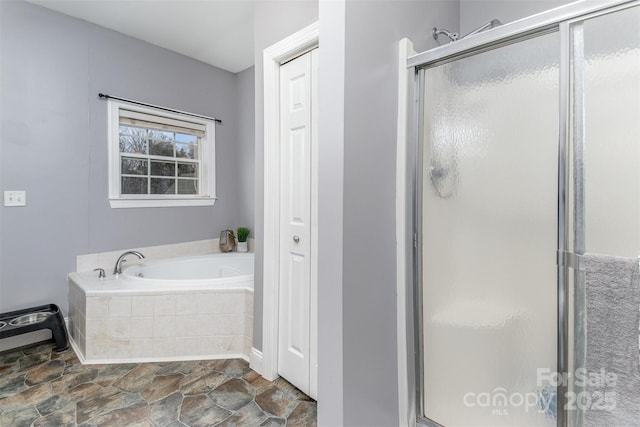 bathroom with shower with separate bathtub