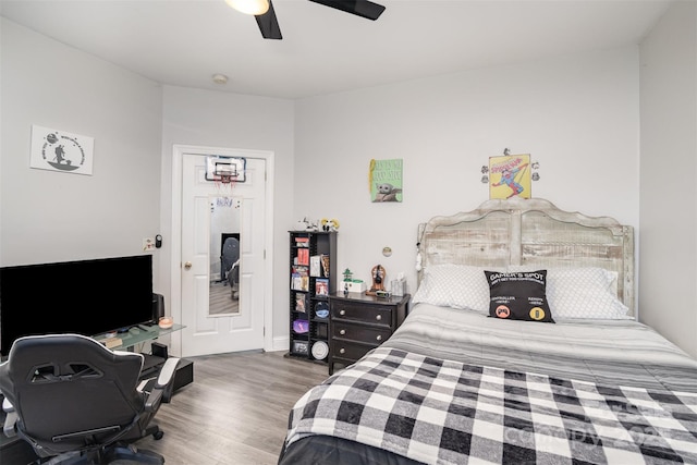 bedroom featuring hardwood / wood-style floors and ceiling fan