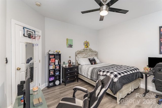 bedroom featuring wood-type flooring and ceiling fan