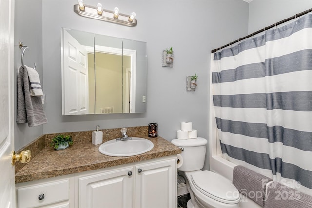 full bathroom with vanity, toilet, and shower / bath combo