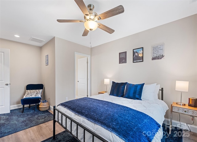 bedroom with dark wood-type flooring and ceiling fan