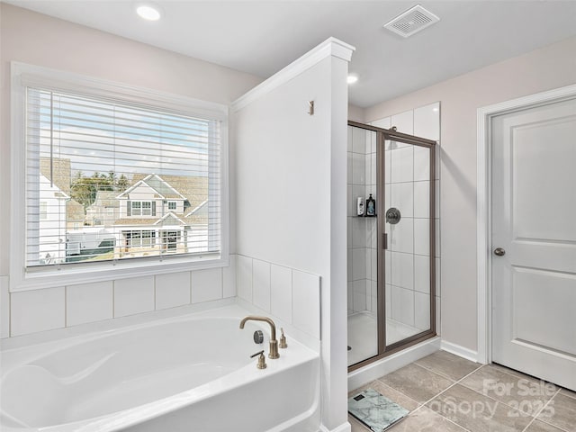 full bath with tile patterned flooring, visible vents, a garden tub, and a shower stall