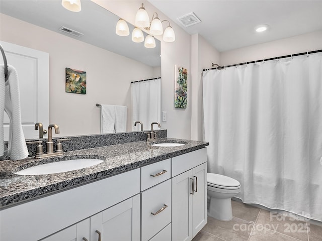 full bathroom featuring double vanity, a sink, and visible vents