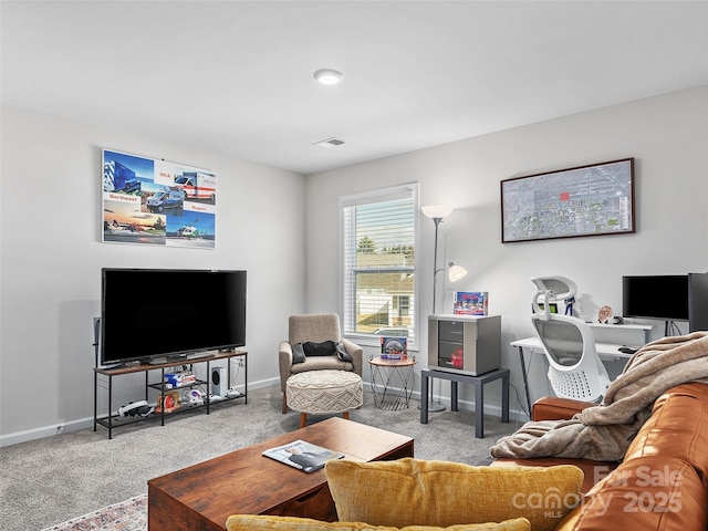 living area featuring light carpet, visible vents, and baseboards