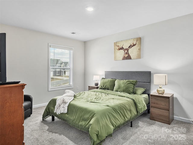 bedroom featuring light carpet, visible vents, and baseboards