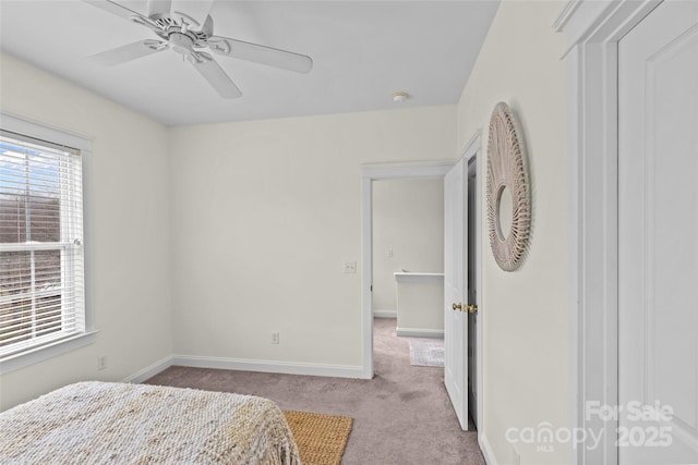 bedroom with ceiling fan and light colored carpet