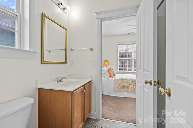 bathroom featuring vanity and toilet