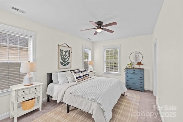 bedroom featuring ceiling fan and light colored carpet