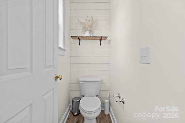 bathroom with wood-type flooring and toilet