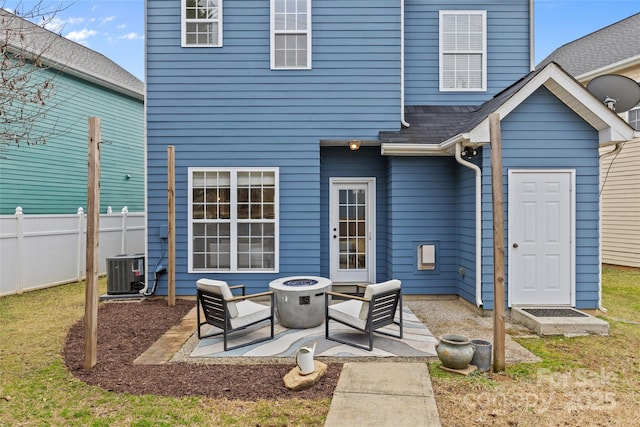 back of property featuring an outdoor fire pit, a patio area, and central air condition unit