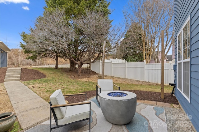 view of patio with a fire pit