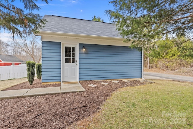 garage featuring a yard