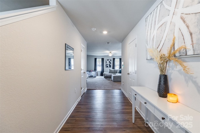 hallway with dark wood-type flooring