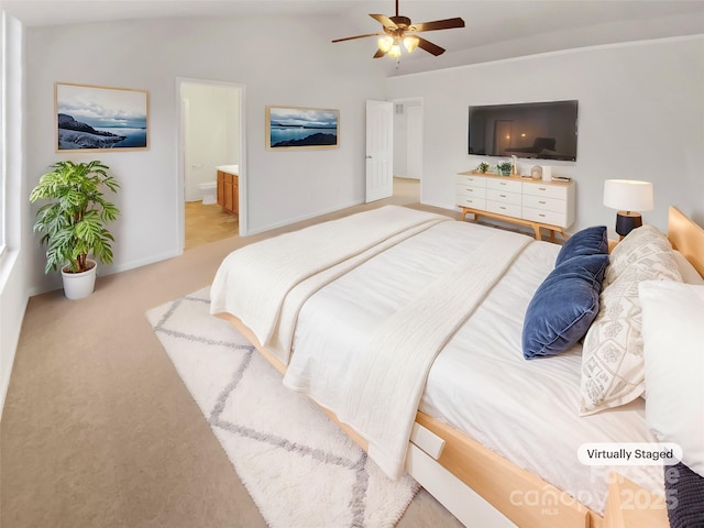 bedroom with light carpet, connected bathroom, and ceiling fan