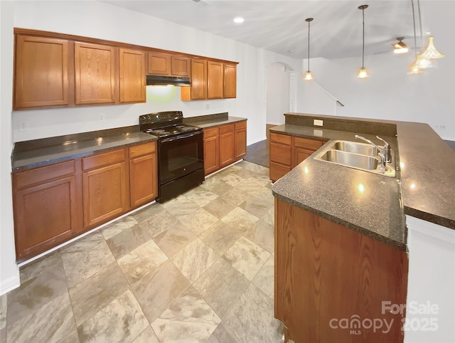 kitchen featuring black range with electric cooktop, hanging light fixtures, and sink