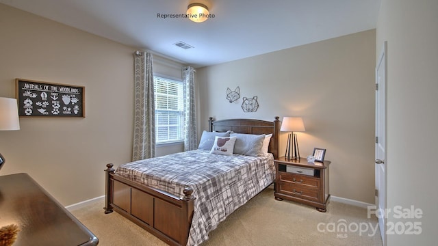 bedroom featuring visible vents, baseboards, and light carpet