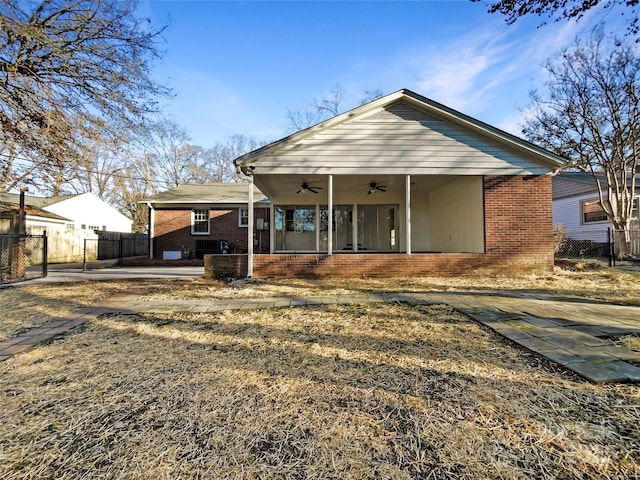 back of property featuring central AC unit and ceiling fan