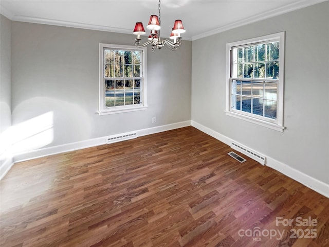 unfurnished room with ornamental molding, a notable chandelier, and dark hardwood / wood-style flooring