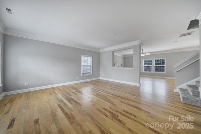 unfurnished living room featuring crown molding, ceiling fan, and light hardwood / wood-style flooring