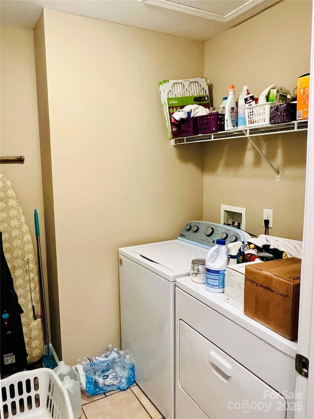 laundry room with tile patterned floors and washing machine and dryer