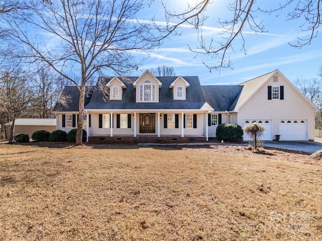 new england style home with a garage and a front lawn