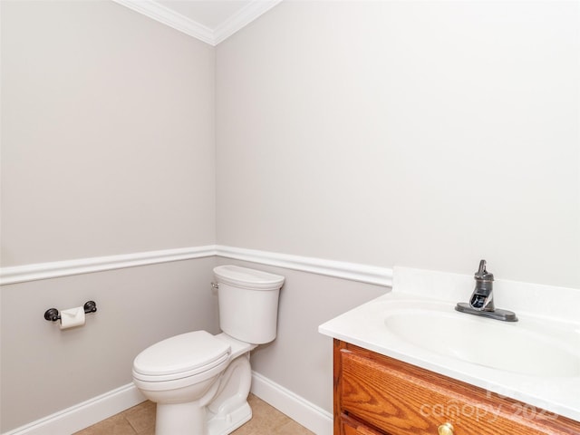 bathroom featuring crown molding, tile patterned floors, vanity, and toilet