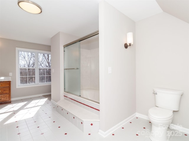 bathroom featuring tile patterned flooring, lofted ceiling, shower / bath combination with glass door, and toilet