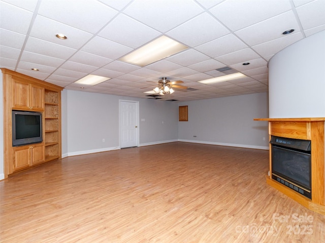 unfurnished living room with ceiling fan and light wood-type flooring