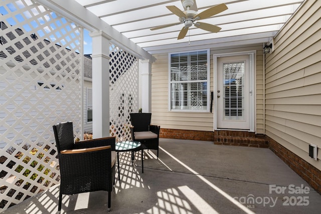 view of patio featuring entry steps, a ceiling fan, and a pergola