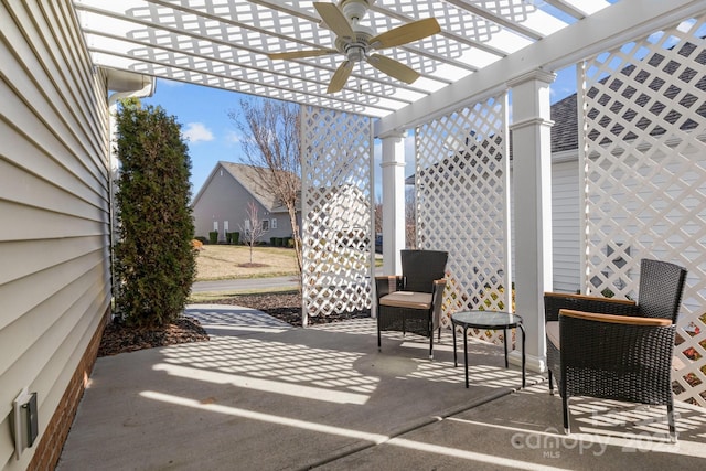 view of patio with ceiling fan and a pergola