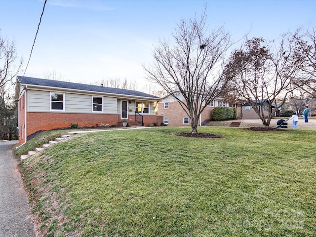 ranch-style house with a front yard