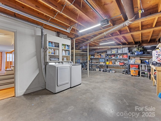 basement with washing machine and clothes dryer