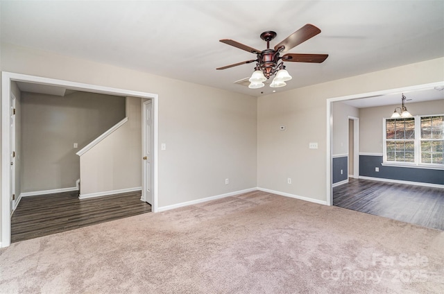 carpeted spare room with ceiling fan