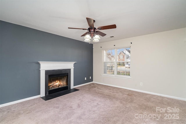 unfurnished living room with carpet floors and ceiling fan