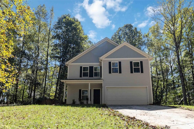 view of front of house featuring a garage and a front lawn