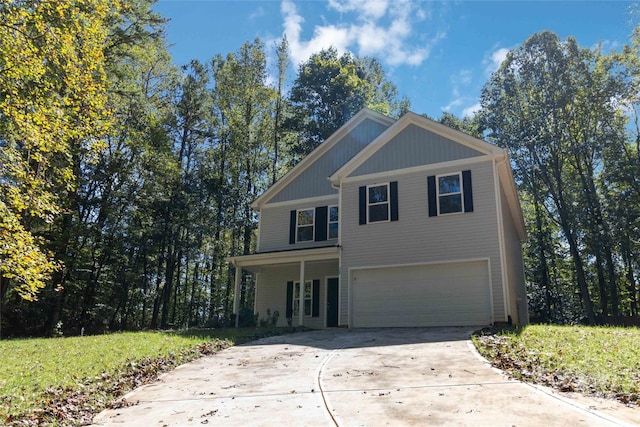 view of front facade featuring a garage and a front yard