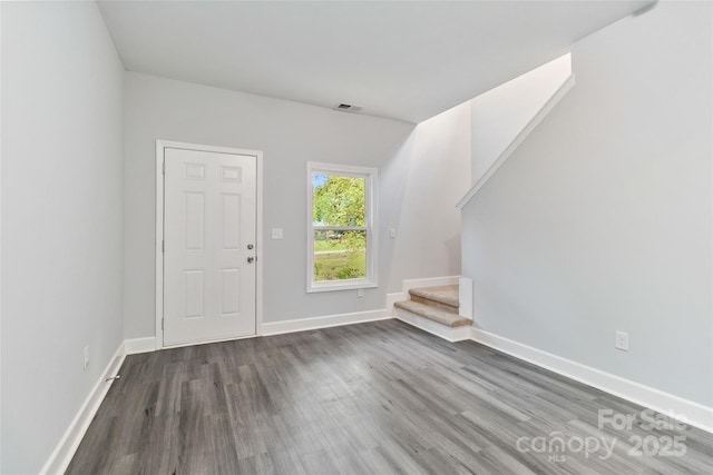 foyer with dark hardwood / wood-style floors