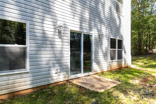 view of side of property featuring a patio