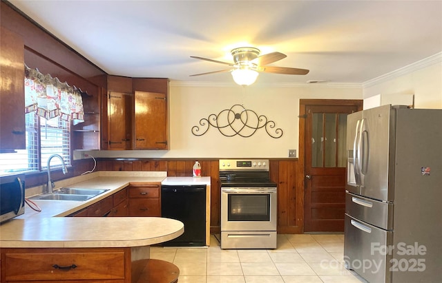 kitchen featuring sink, crown molding, light tile patterned floors, kitchen peninsula, and stainless steel appliances