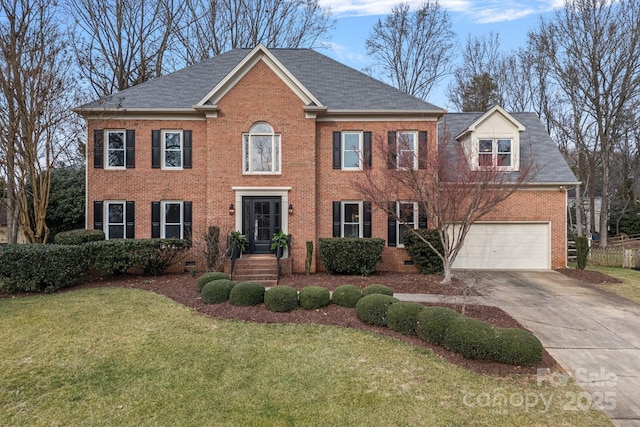 colonial-style house with a garage and a front yard