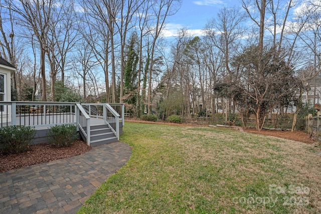 view of yard featuring a wooden deck