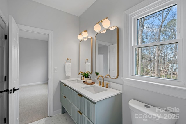 bathroom featuring vanity and toilet