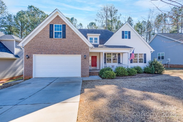 view of property featuring a porch and a garage