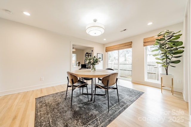 dining room with visible vents, baseboards, wood finished floors, and recessed lighting